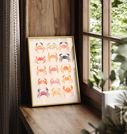 Framed art print showing twelve watercolor crabs in vibrant seaside colors